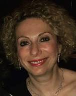 Image may contain: 5 people, including Eugenia Ayrian, people smiling, people standing and night